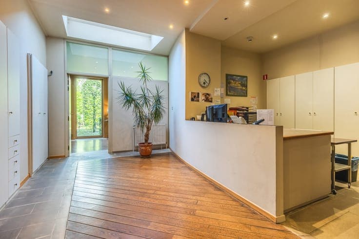 A charming mixed-use building comprising 3 units and garden
