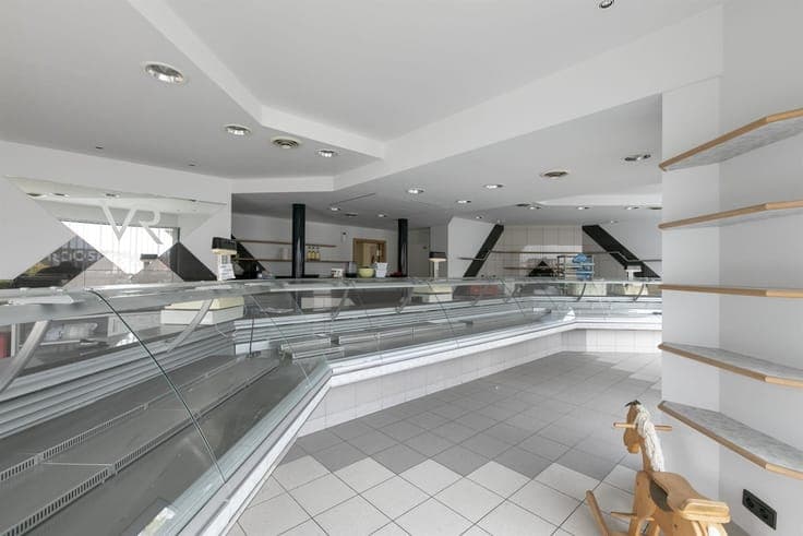 Revenue property consisting of commercial store and 2 apartm