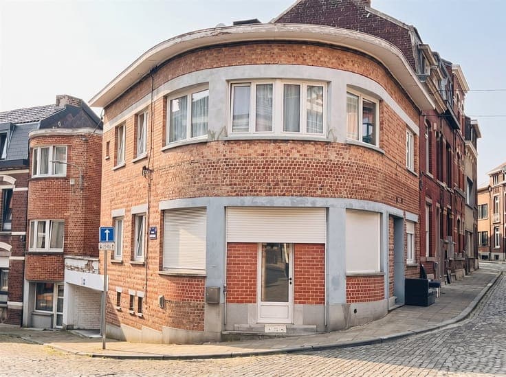 Former commercial building divided into two separate apartme