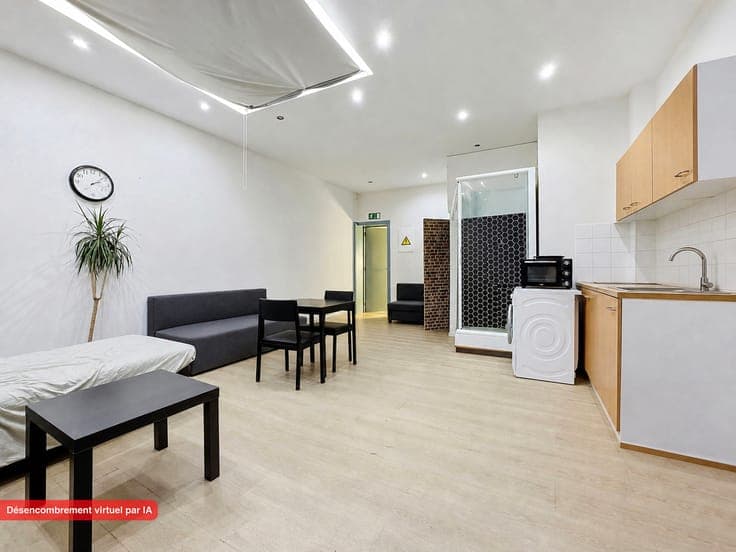 Jette: mixed-use building ground‑floor commercial + duplex
