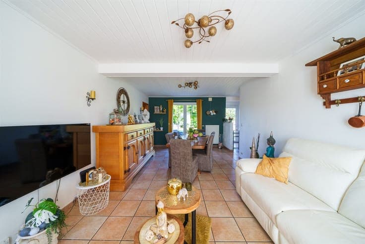 Single-story detached villa with a garden and garage