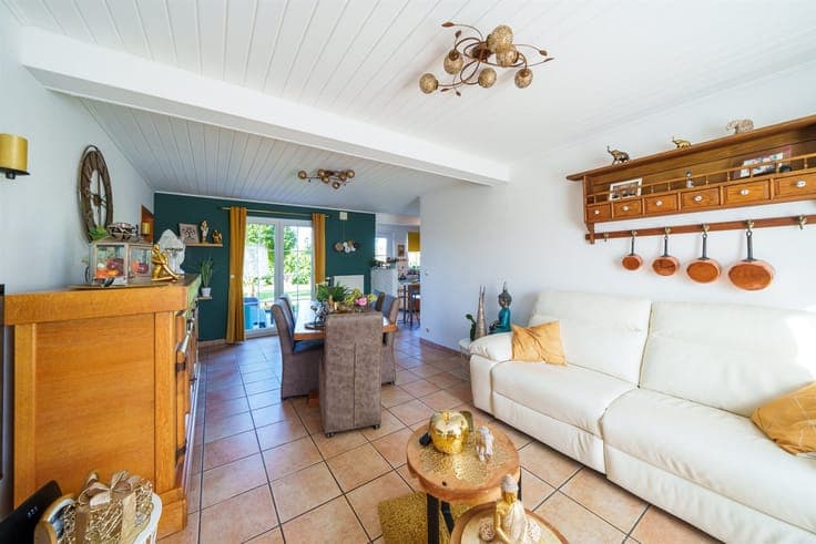 Single-story detached villa with a garden and garage