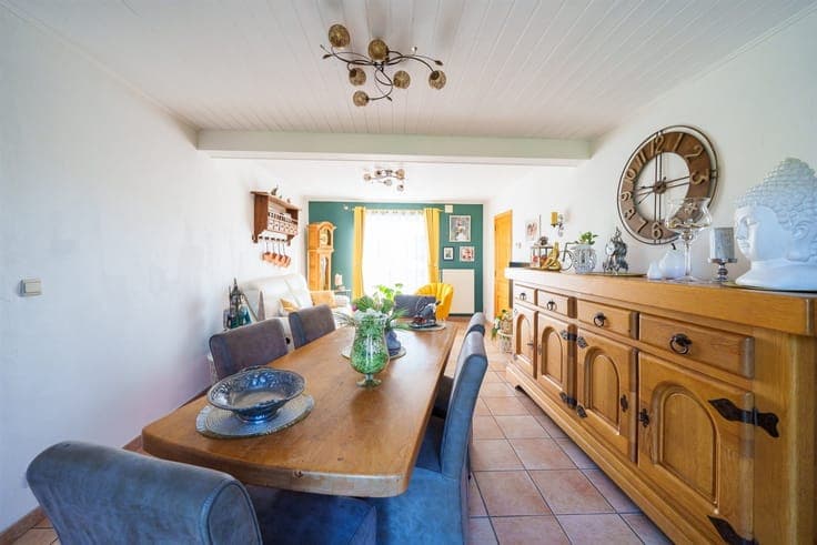 Single-story detached villa with a garden and garage