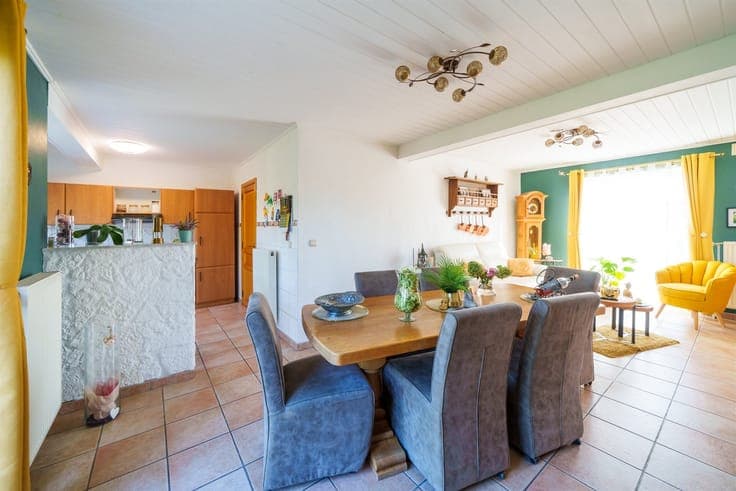 Single-story detached villa with a garden and garage