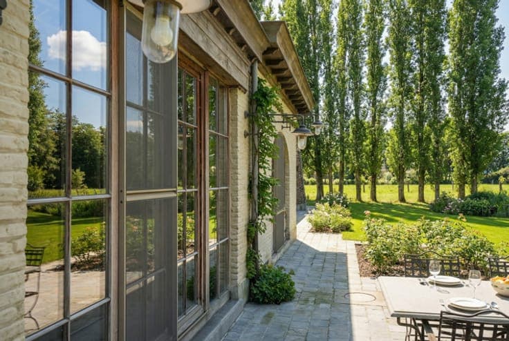 EXCEPTIONAL square farmhouse with numerous possibilities!