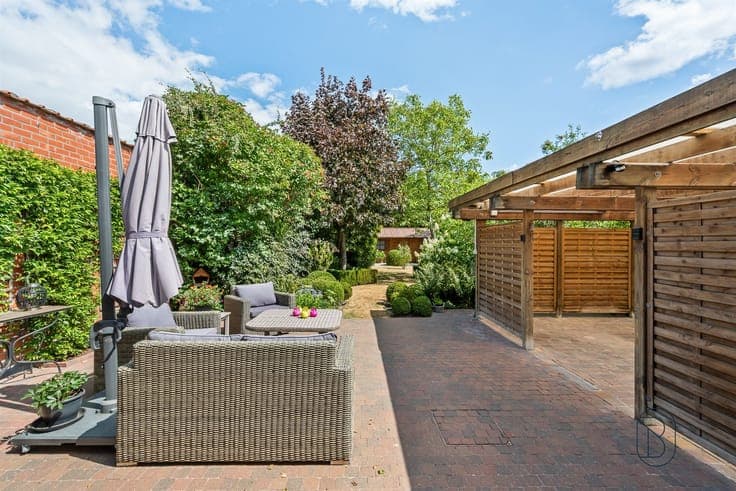 Well-maintained semi-detached home with a cozy garden and ca