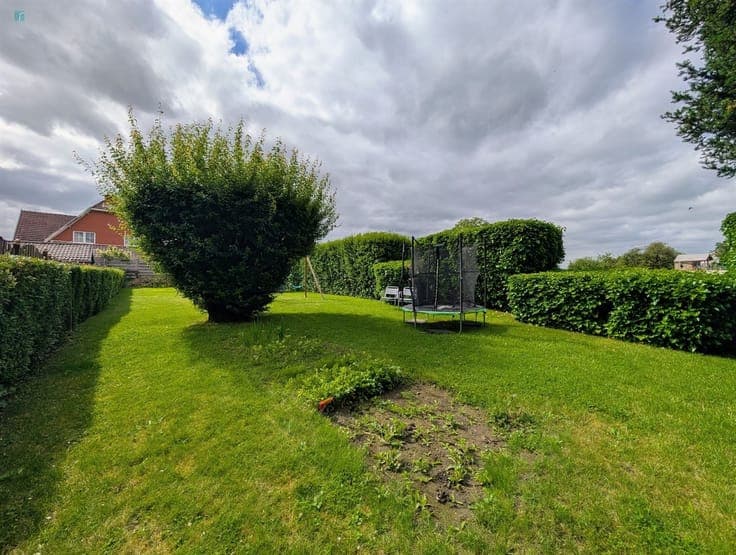 Maison 4 chambres avec jardin clôturé et garage