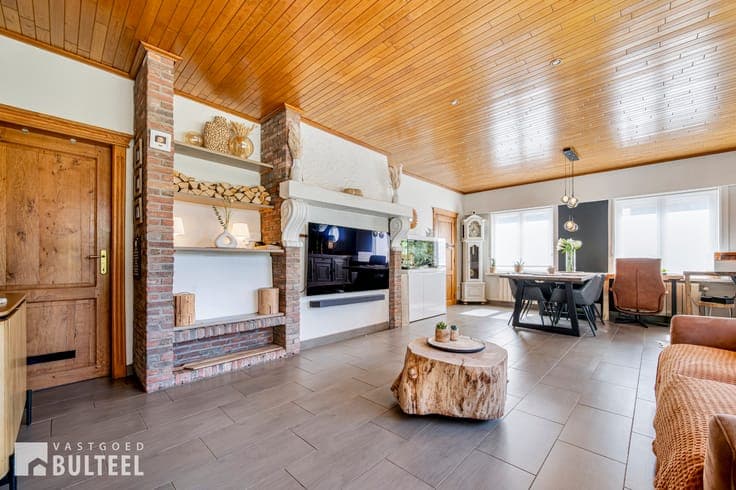 Energiezuinige woning met magazijn en grote tuin!