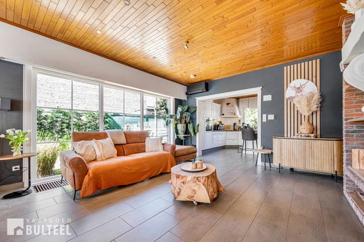 Energiezuinige woning met magazijn en grote tuin!