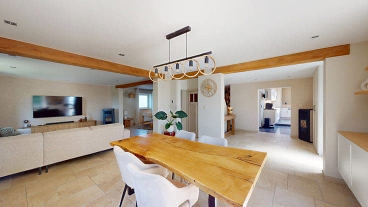 A charming, renovated house with a garage and an outbuilding