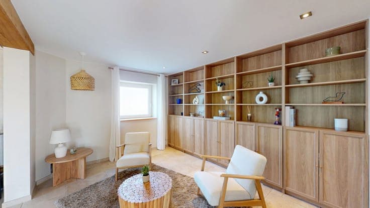 A charming, renovated house with a garage and an outbuilding