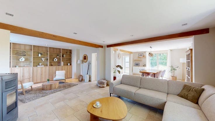A charming, renovated house with a garage and an outbuilding