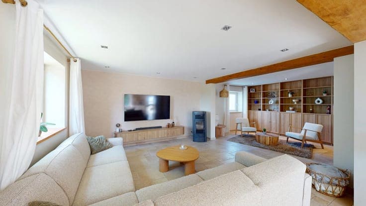 A charming, renovated house with a garage and an outbuilding