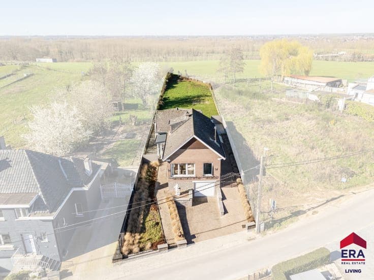 Home to modernise with garage, garden and open green view