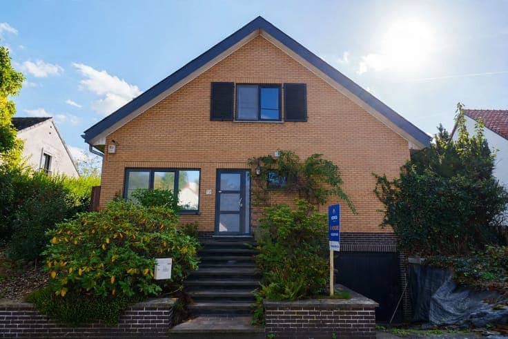 Spacious house with a south-facing yard in need of some upda