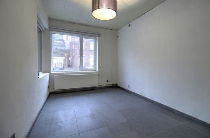 IMMEUBLE COMPRENANT UNE PARTIE ENTREPOT