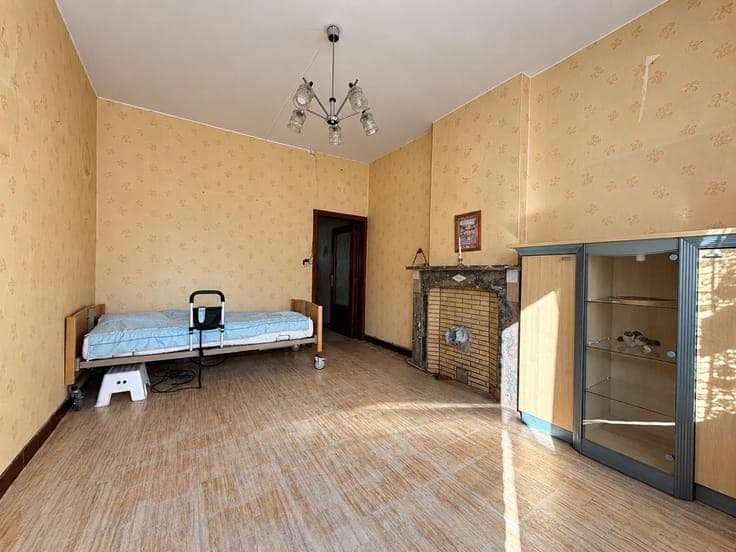 House in need of renovation with a garden and a side passage