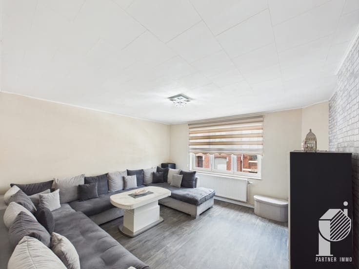 3-bedroom house with garden and 3 large garages for sale.