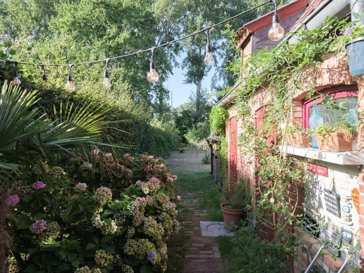 Turnkey home with abundant light and beautiful garden