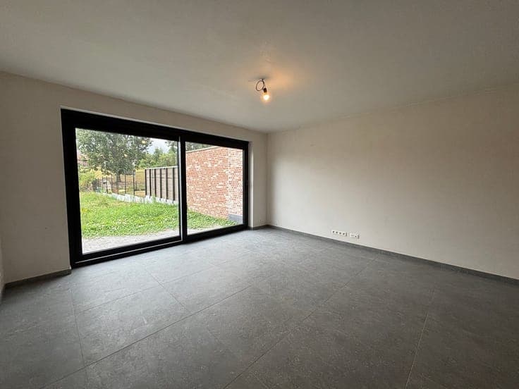 NEW CONSTRUCTION HOME WITH 4 BEDROOMS, A GARAGE, AND A GARDE