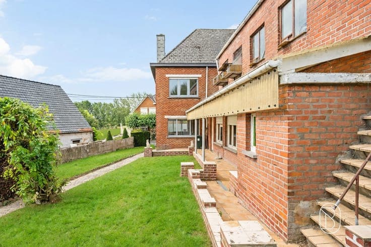 Spacious home in need of renovation with 4 bedrooms and a ga