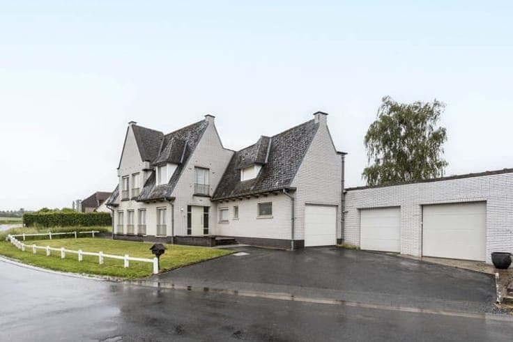 Unique property with driveway, garden & garages.