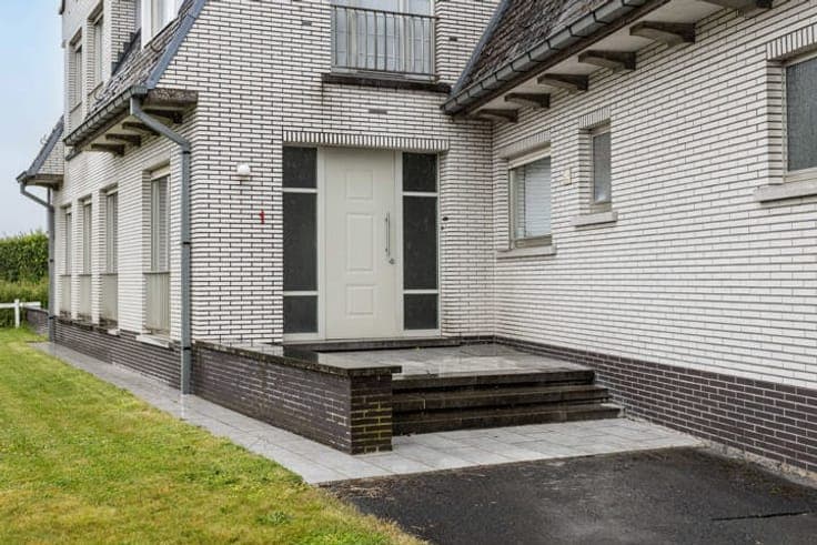 Unique property with driveway, garden & garages.