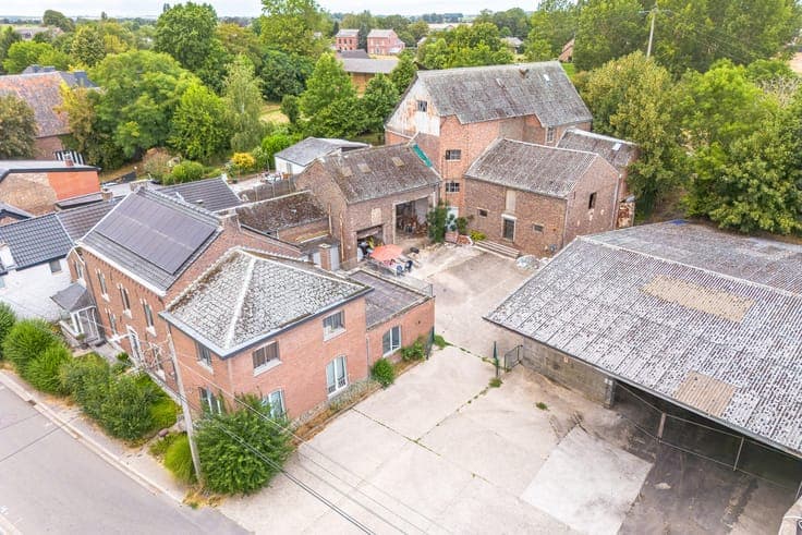 Property with two houses, a workshop, and a meadow