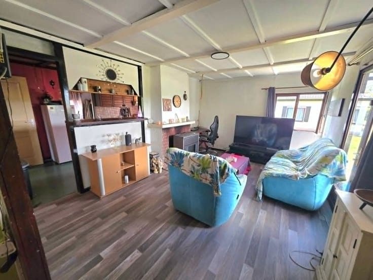 Terrain à bâtir de 720 m² avec chalet,3 garages et 3 annexes