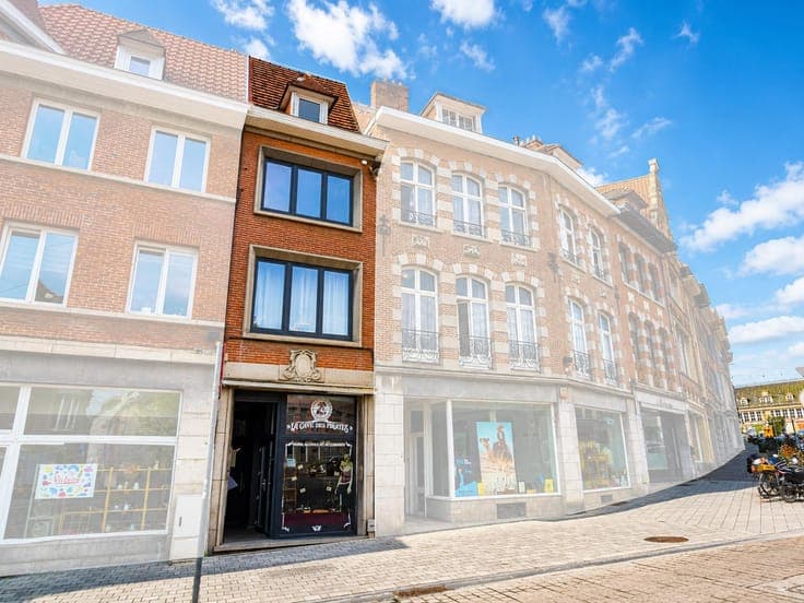 Mixed-use building with shops and duplex apartments – just s