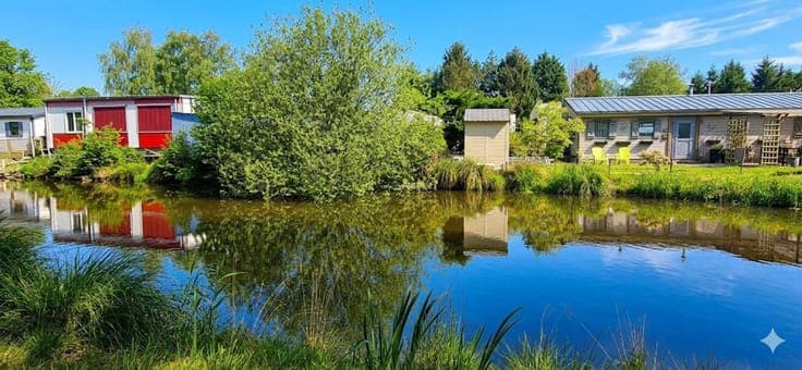 Residential caravan with land and pond view