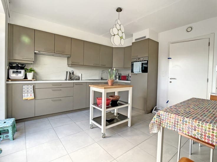 Zongerichte woning met tuin te Adindkerke.
