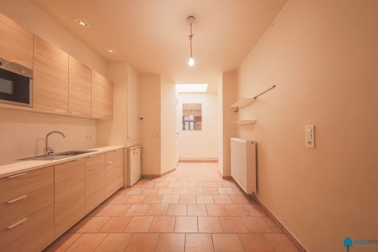 House consisting of a studio and a triplex apartment