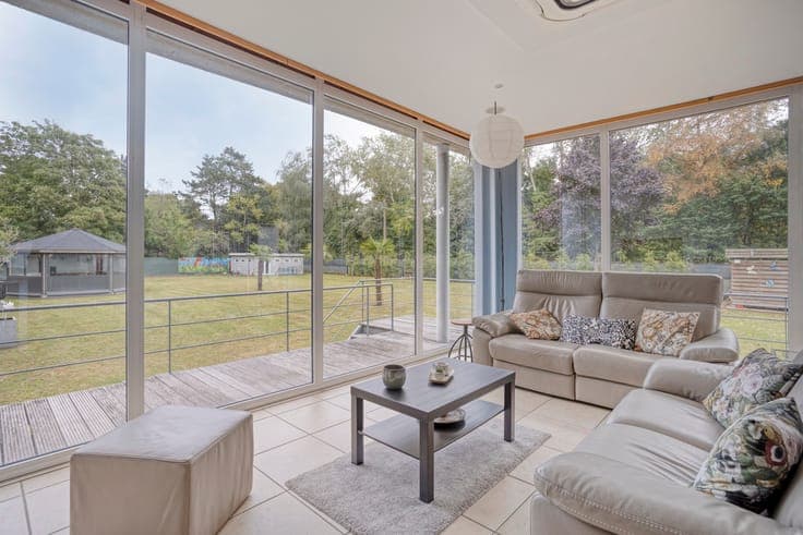 Property company with a charming villa with a spacious garde