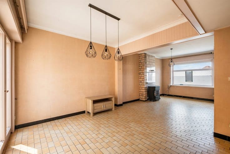 A home in need of renovation with 3 bedrooms, a city garden,