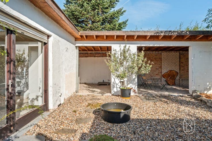 Ruime woning met werkplaats van 200 m² en diepe tuin