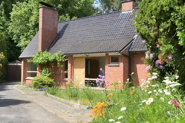 Nestled in greenery, on the edge of the forest.