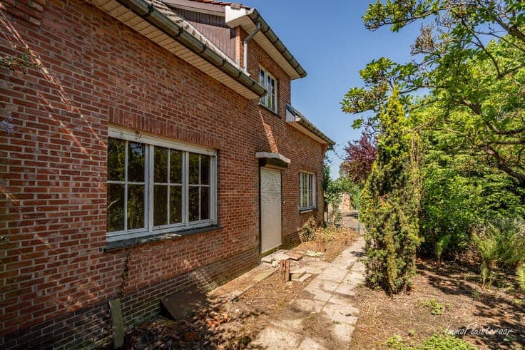 Uniquely located to renovate house with stable building on