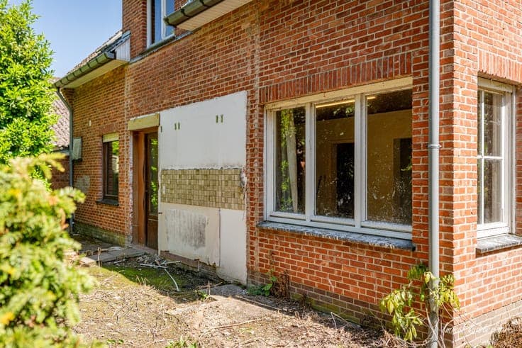 Uniquely located to renovate house with stable building on