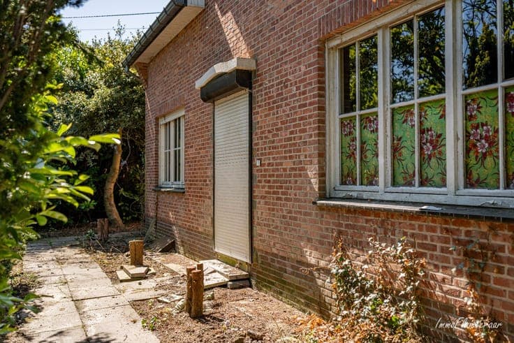 Uniquely located to renovate house with stable building on