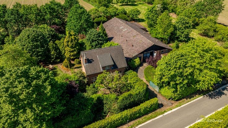 Uniquely located to renovate house with stable building on