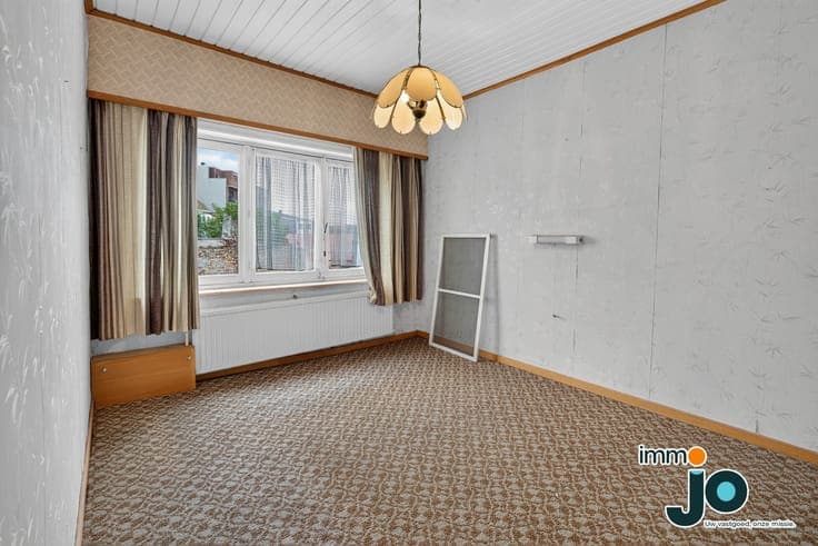 A family home in need of some updating, with a sunny cour...