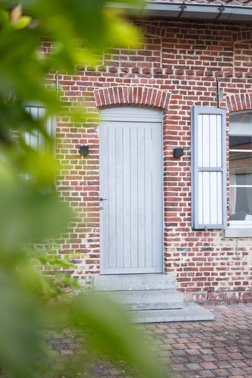 Renovated house for sale with a large shed in Lierde