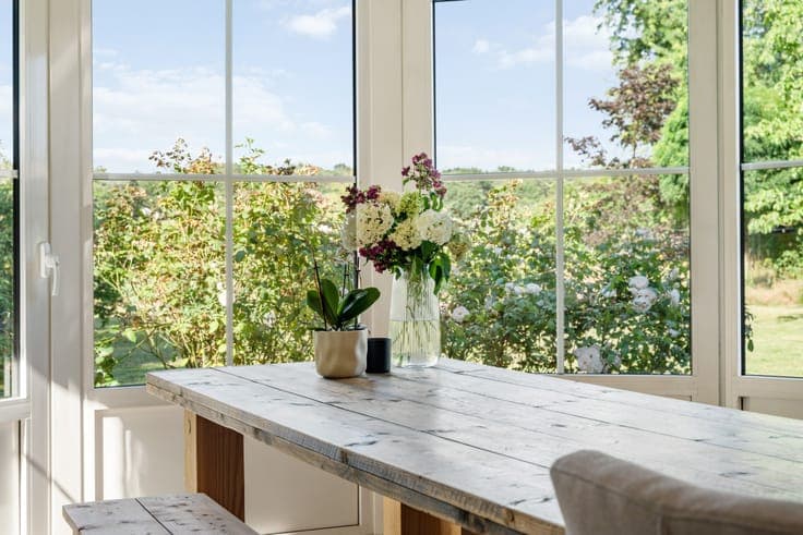 Classic villa with a view of meadows and a horse stable.
