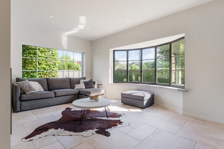 Classic villa with a view of meadows and a horse stable.
