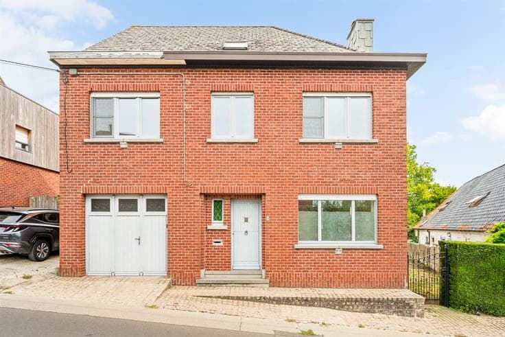 Spacious home in need of renovation with 4 bedrooms and a ga