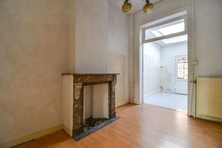 Charming townhouse in need of renovation with a city garden