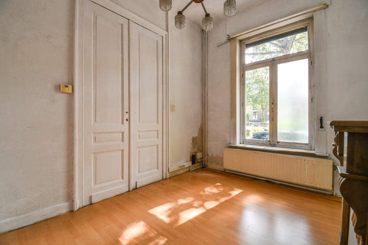 Charming townhouse in need of renovation with a city garden